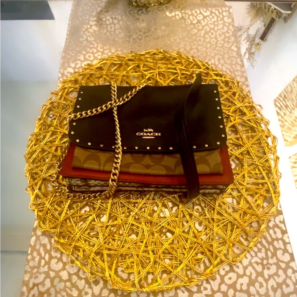 Coach Leather Crossbody Bag with Monogram Pattern and gold accents